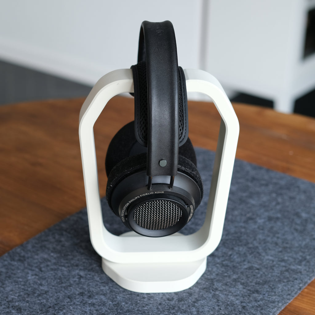 Headphone Display Stand showcasing stylish design with headphones resting on a modern stand, enhancing desk aesthetics.