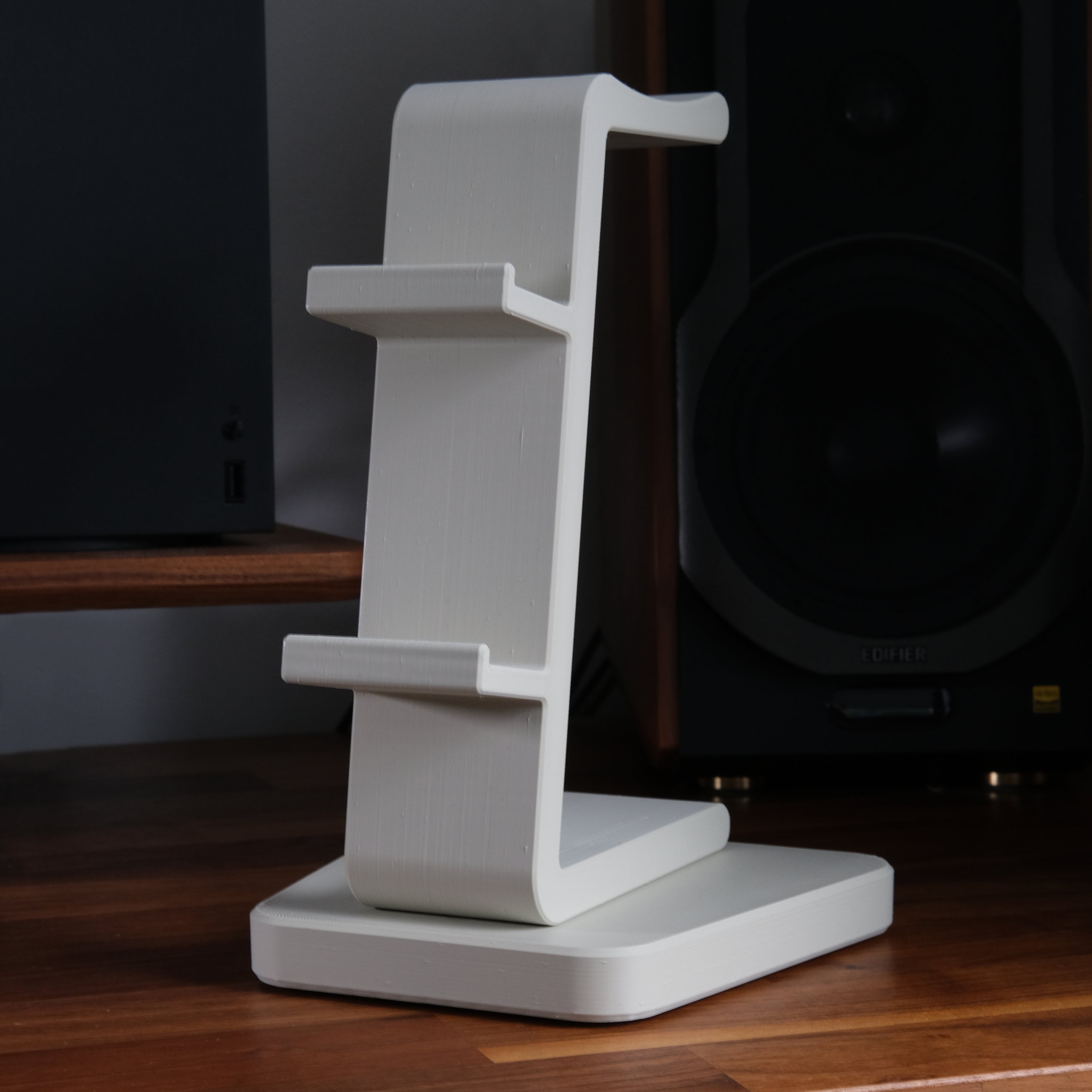 All-in-One Headset and Controller Gaming Stand displayed in a sleek design to hold gaming equipment.